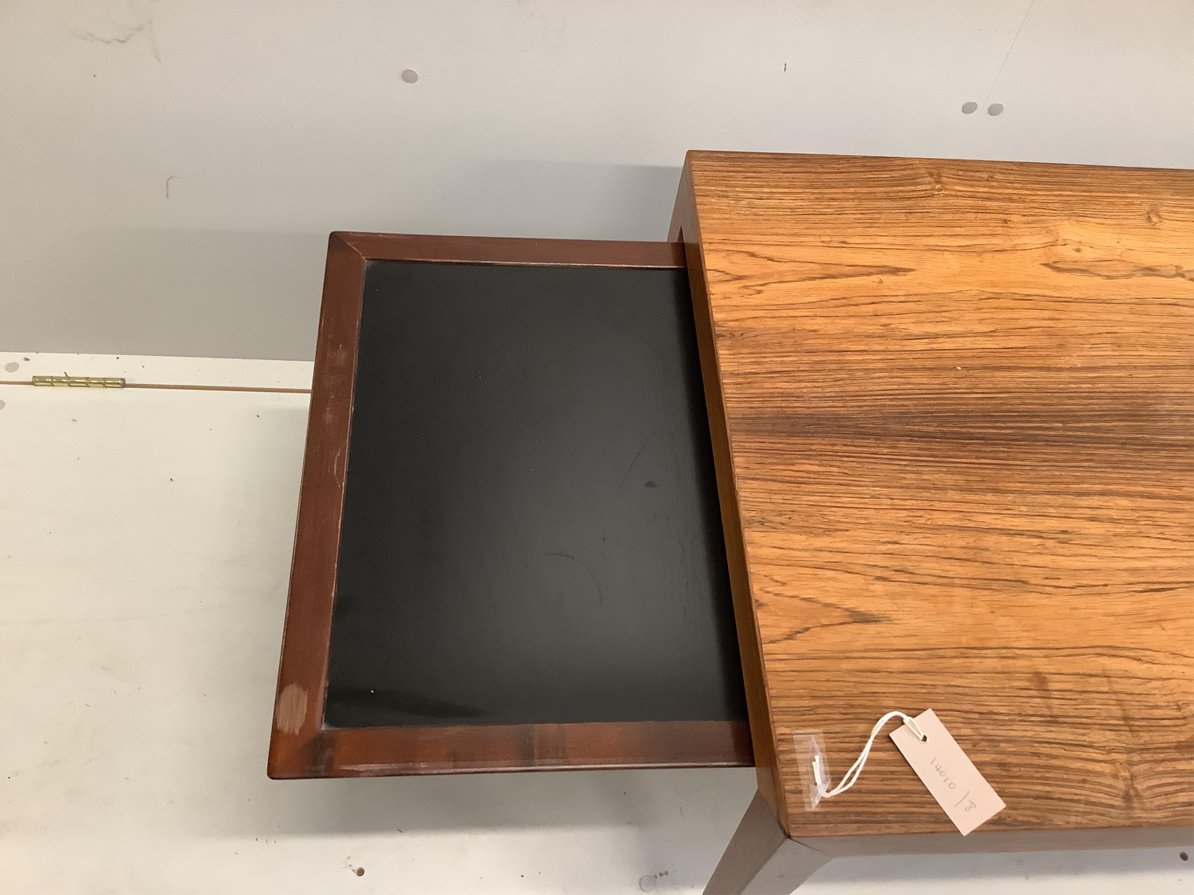 In the manner of Johannes Anderson, a mid century rectangular Indian rosewood coffee table, width 150cm, depth 60cm, height 50cm